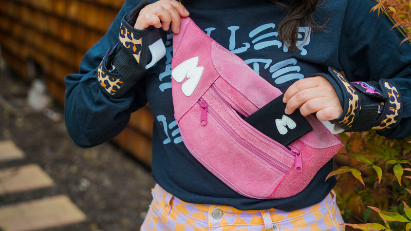 Itty Bitty Bangin' Billfold being put into a Moxi FUn Bag