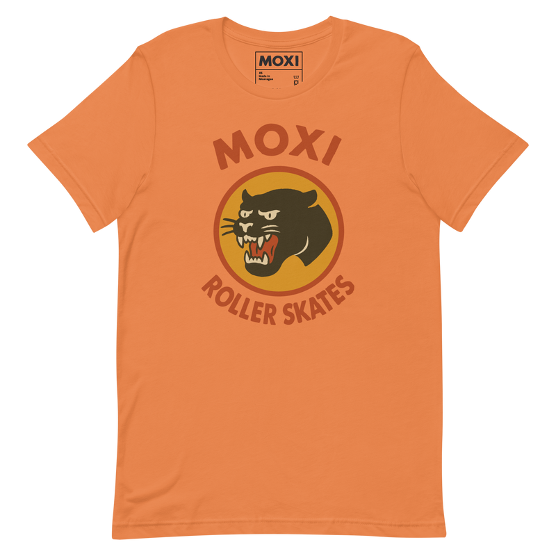 Moxi unisex T-shirt featuring a bold black panther graphic in an orange circle with red “MOXI Roller Skates” text in vintage-style lettering. Soft cotton fabric with a classic fit, perfect for casual wear or skate sessions.
