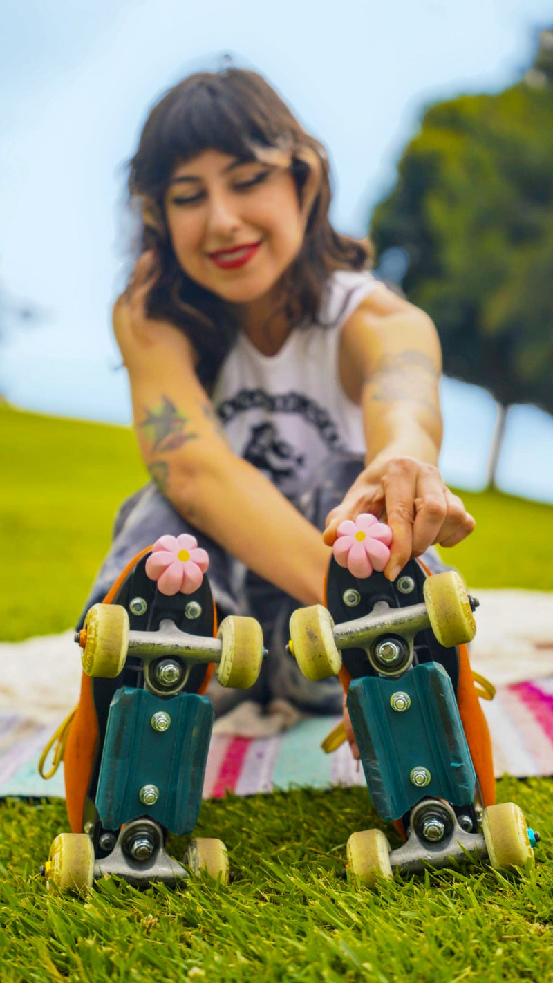 Pink Brake Petals Toe Stops being adjusted by Evelyn