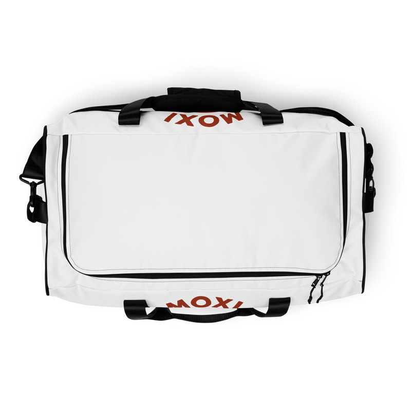 White Moxi duffel bag with black straps and shoulder pad, featuring a bold panther logo in an orange circle and red “MOXI Roller Skates” text printed on the front panel.
