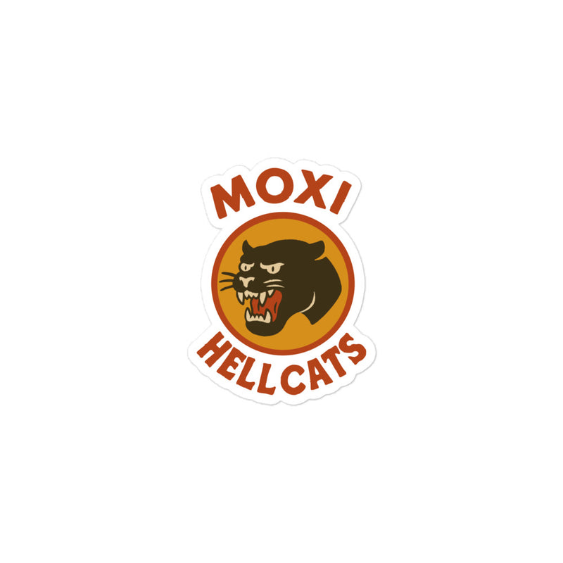 Die-cut Moxi Hellcats sticker featuring a snarling black panther graphic in an orange circle with bold red “MOXI” text above and “HELLCATS” below, outlined in white for a peel-and-stick finish.