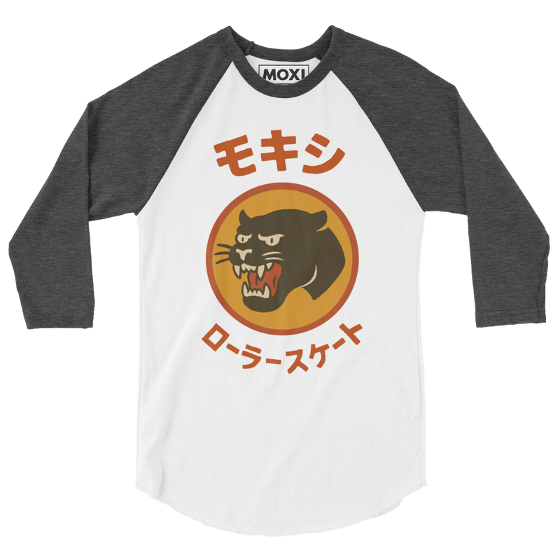 Grey and white Moxi baseball tee with three-quarter raglan sleeves, featuring a bold retro-style panther logo in an orange circle and Japanese katakana text above and below the graphic translating to "Moxi Roller Skates."