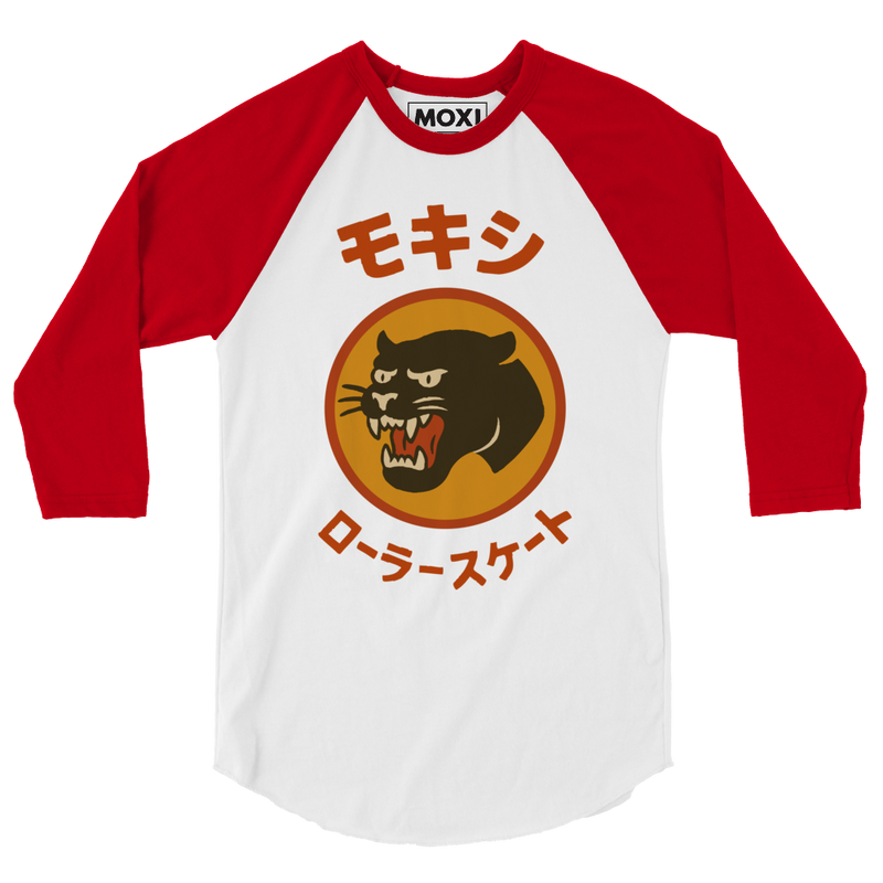Red and white Moxi baseball tee with three-quarter raglan sleeves, featuring a bold retro-style panther logo in an orange circle and Japanese katakana text above and below the graphic translating to "Moxi Roller Skates."