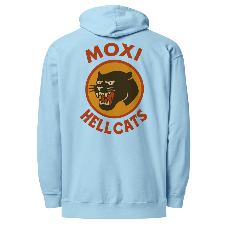Light blue Moxi hoodie with a large back graphic featuring a retro-style black panther logo inside an orange circle, with bold red “MOXI” text above and “HELLCATS” below.