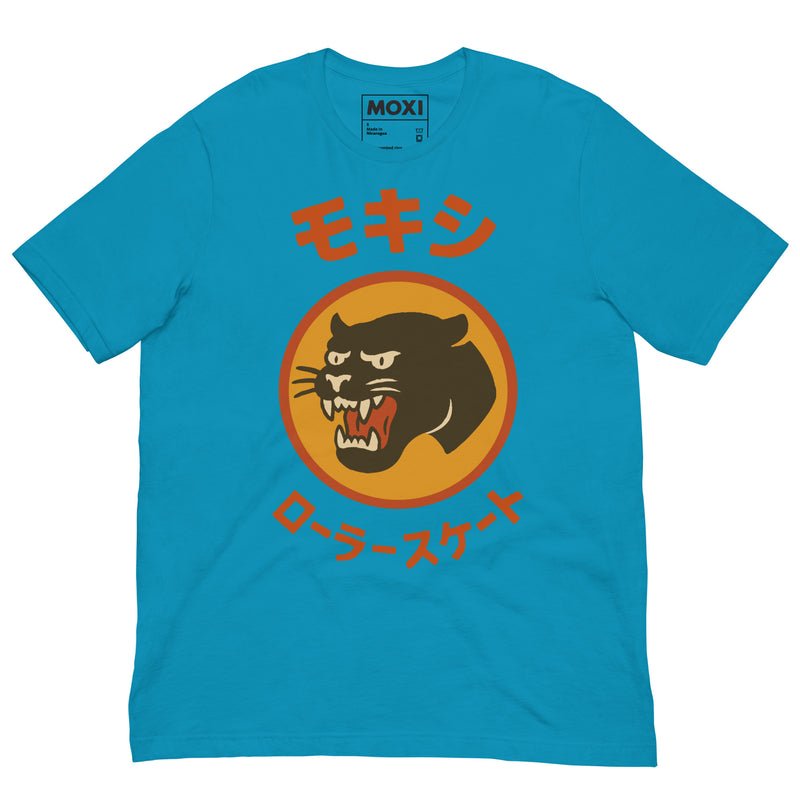 Blue Moxi unisex T-shirt featuring a bold black panther logo in an orange circle with red Japanese katakana text above and below, translating to “Moxi Roller Skates.” Soft cotton fabric with a classic crew neck fit.
