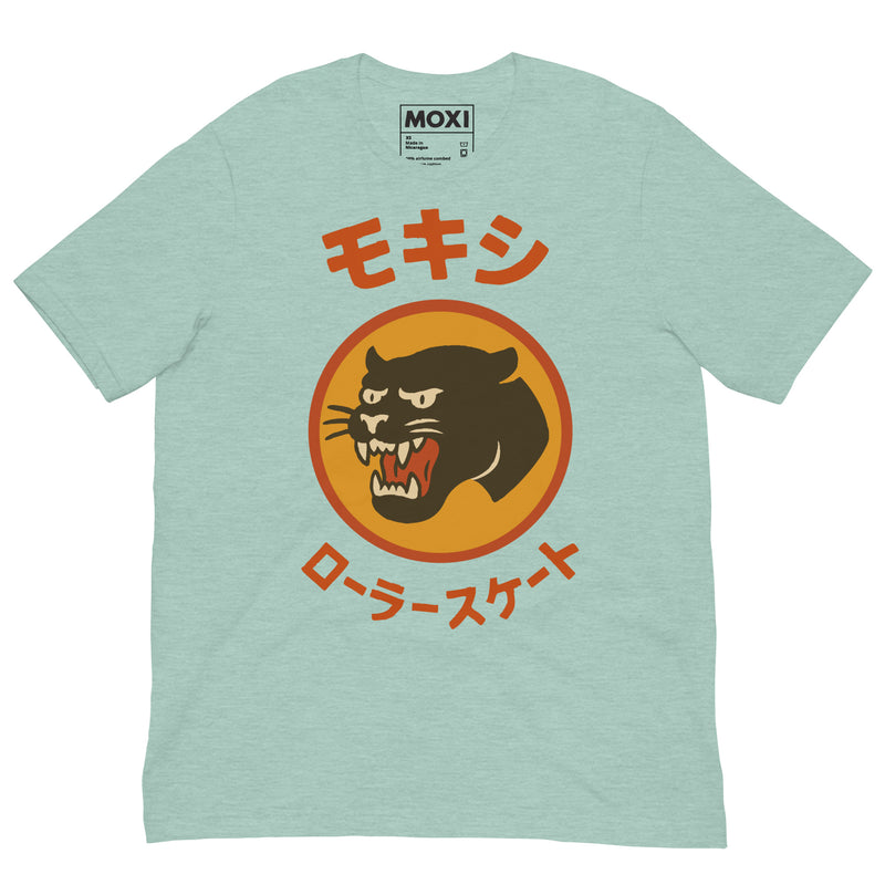 Mint green Moxi unisex T-shirt featuring a bold black panther logo in an orange circle with red Japanese katakana text above and below, translating to “Moxi Roller Skates.” Soft cotton fabric with a classic crew neck fit.