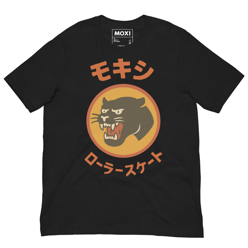 Black Moxi unisex T-shirt featuring a bold black panther logo in an orange circle with red Japanese katakana text above and below, translating to “Moxi Roller Skates.” Soft cotton fabric with a classic crew neck fit.