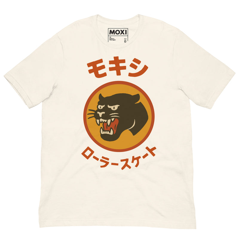 Cream Moxi unisex T-shirt featuring a bold black panther logo in an orange circle with red Japanese katakana text above and below, translating to “Moxi Roller Skates.” Soft cotton fabric with a classic crew neck fit.