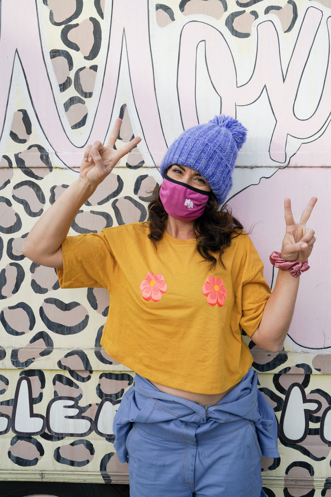 Estro Jen throwing peace signs in Brake Petals Crop Top